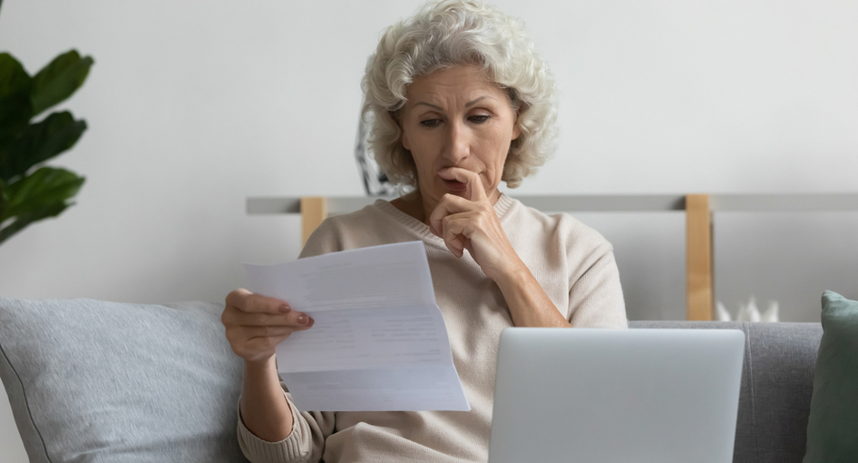 A woman looking at some paperwork.