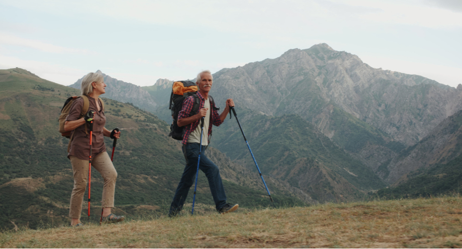 A retired couple hiking.