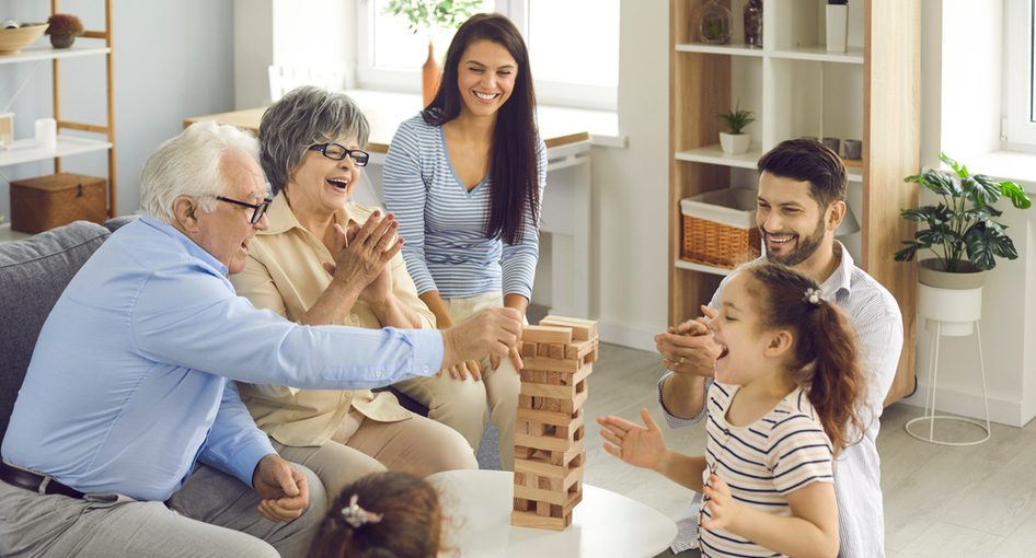 Grandparents playing a game with their grandchildren.