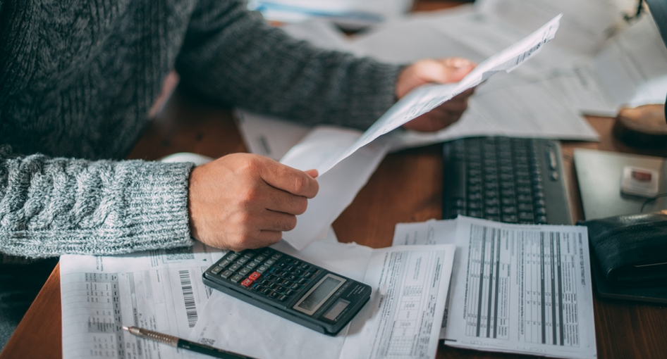 A man looking at some paperwork.