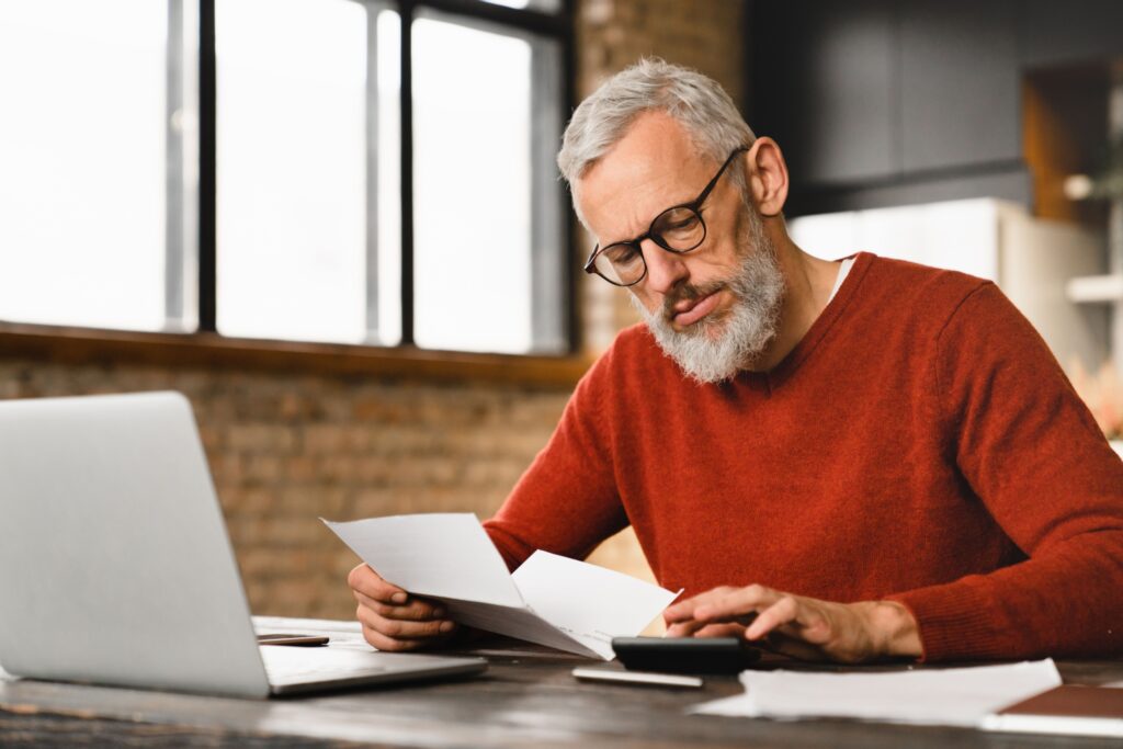 A man reading some paperwork.
