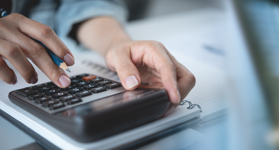 A person using a calculator.